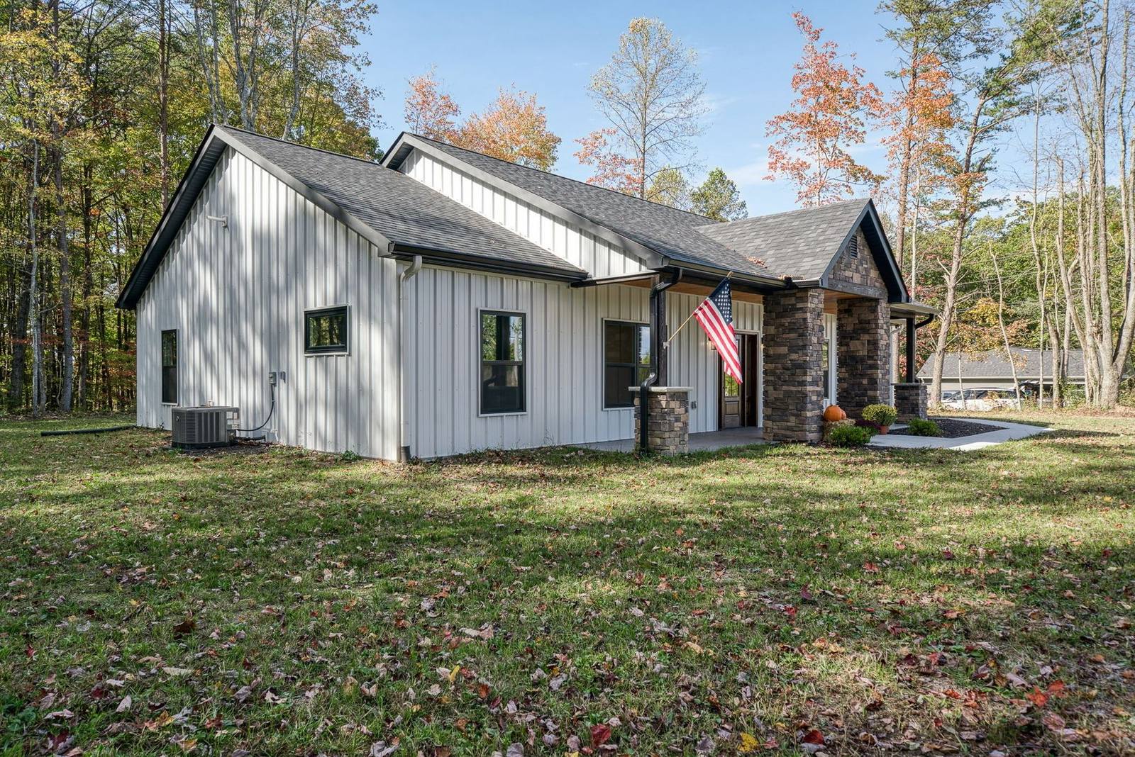 Rear elevation of the completed custom home on a wooded lot