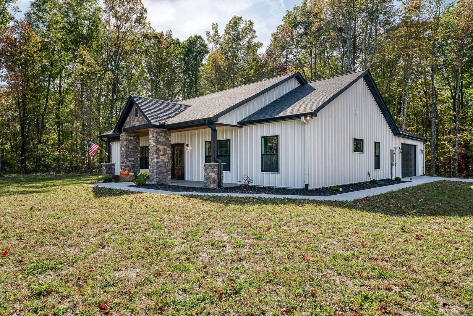 Side elevation showing board-and-batten siding and metal roof lines